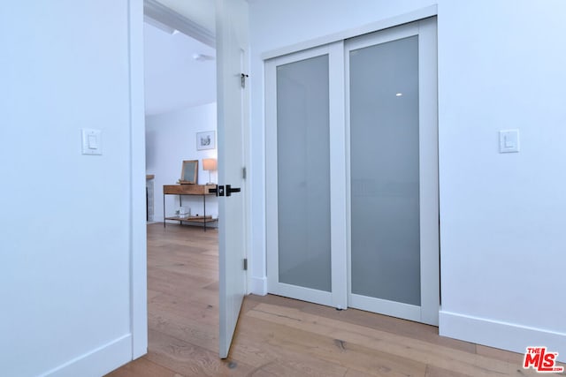 hallway with light wood-type flooring