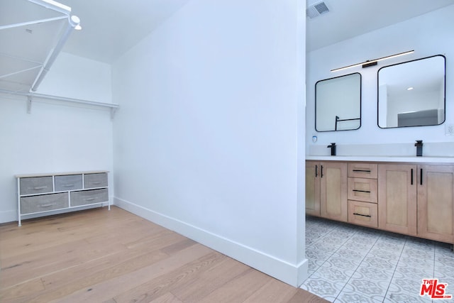 interior space featuring light hardwood / wood-style flooring and sink