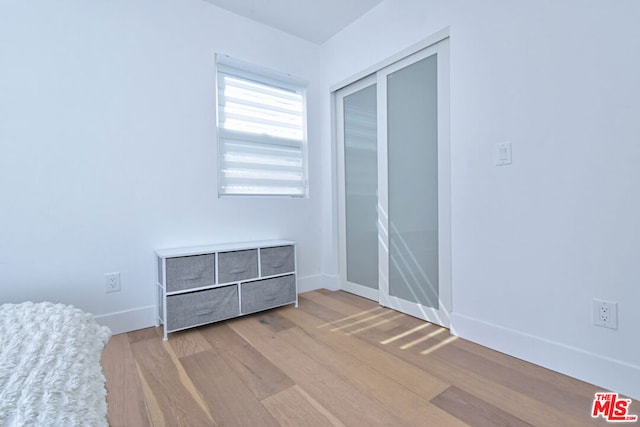 unfurnished bedroom with light hardwood / wood-style floors