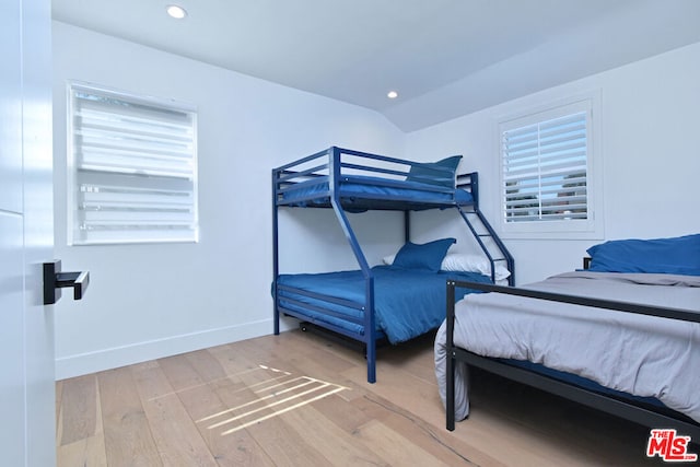 bedroom with hardwood / wood-style floors