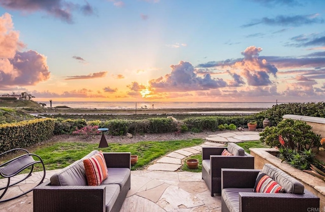 patio terrace at dusk with a water view