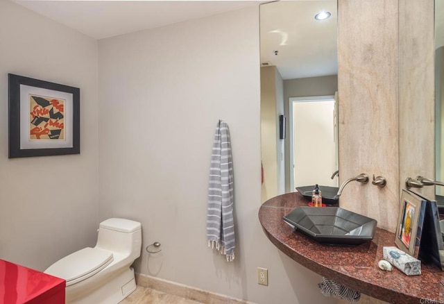 bathroom featuring toilet and sink