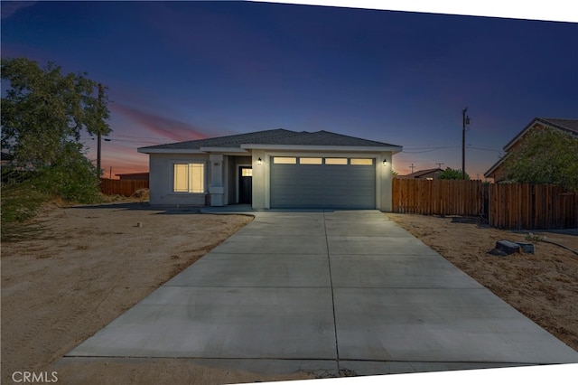 view of front of property with a garage