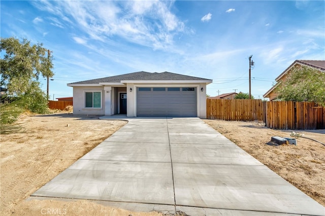 ranch-style home featuring a garage