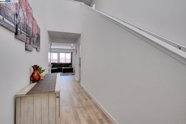 hall with light wood-type flooring