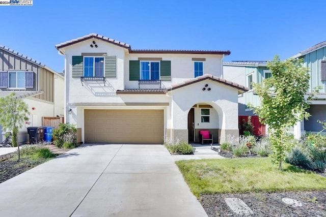 mediterranean / spanish-style house featuring a garage