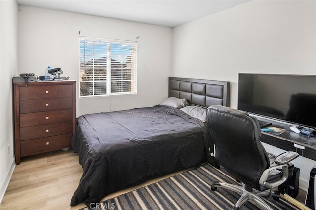 bedroom with light hardwood / wood-style flooring