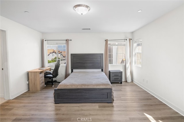 bedroom featuring hardwood / wood-style flooring