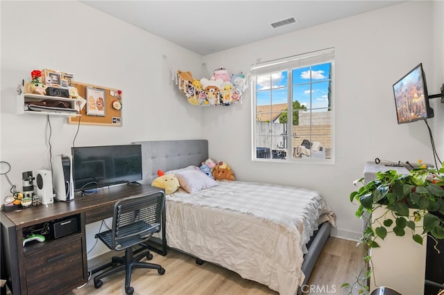 bedroom with light hardwood / wood-style floors