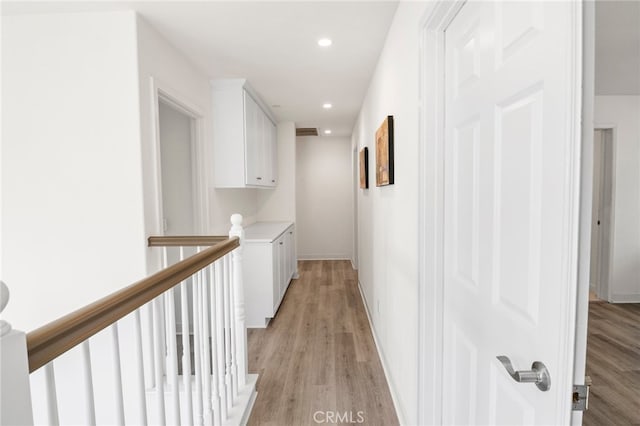 hallway with light wood-type flooring