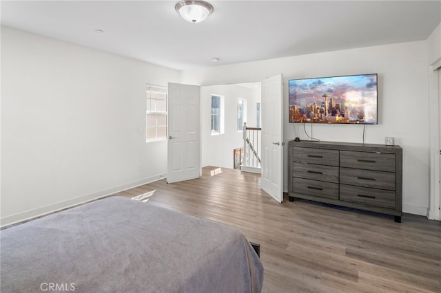 unfurnished bedroom with hardwood / wood-style flooring