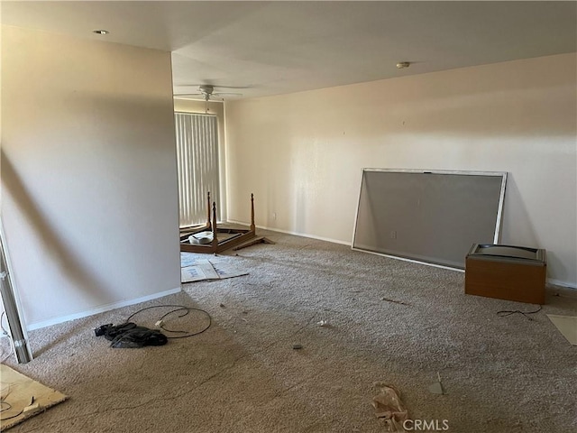 unfurnished room featuring carpet flooring and ceiling fan