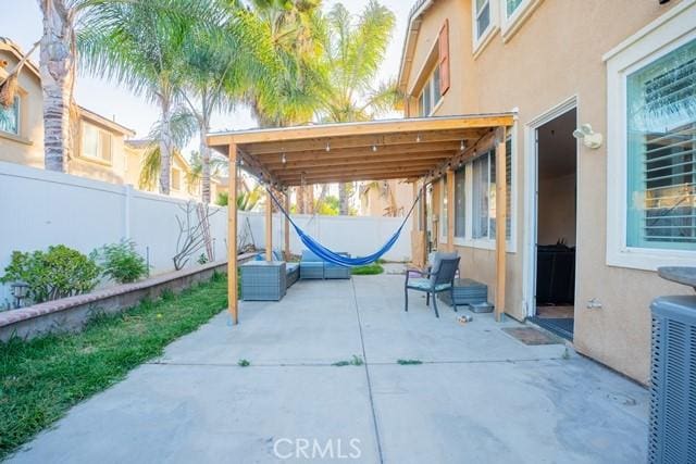 view of patio with central AC unit