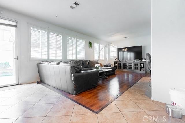 tiled living room featuring a healthy amount of sunlight