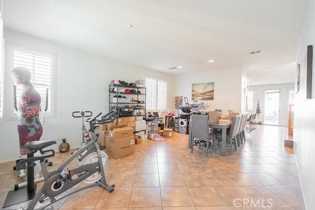 workout area with light tile patterned floors