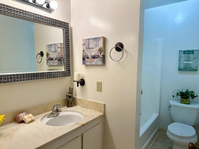 full bathroom with toilet, vanity, tile patterned floors, and washtub / shower combination