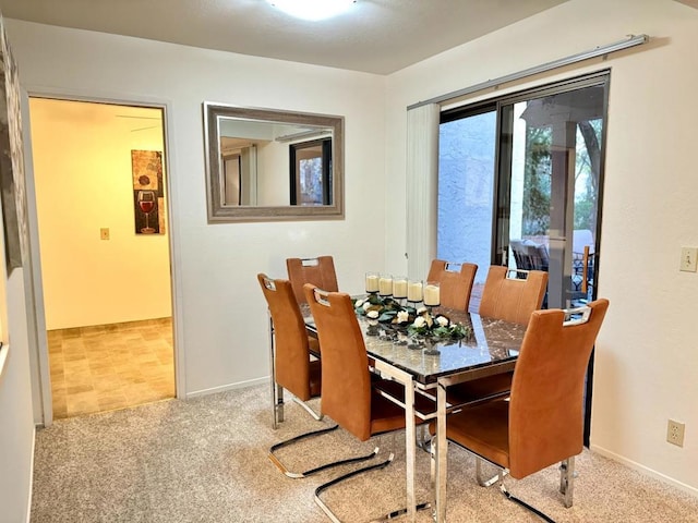 view of carpeted dining space