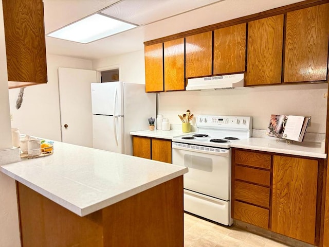 kitchen with white appliances and kitchen peninsula