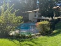 exterior space featuring a fenced in pool