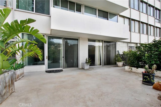 doorway to property with a patio