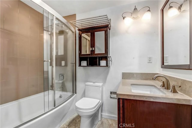 full bathroom with combined bath / shower with glass door, vanity, and toilet