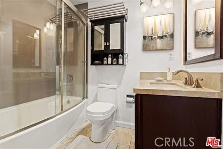 full bathroom featuring combined bath / shower with glass door, toilet, and vanity