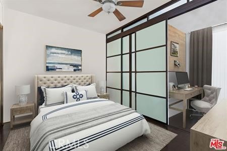 bedroom featuring dark hardwood / wood-style floors and ceiling fan