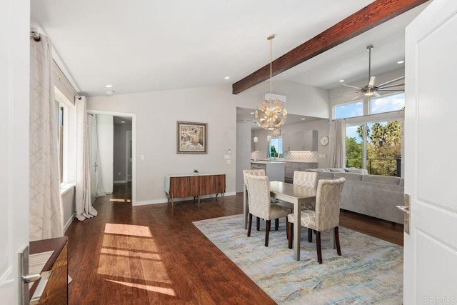 dining space with vaulted ceiling with beams, dark wood-type flooring, and ceiling fan with notable chandelier