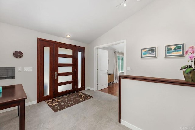 foyer entrance with vaulted ceiling