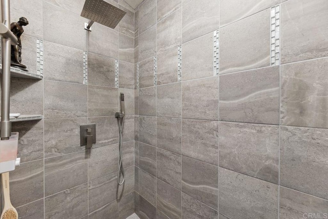 bathroom with tiled shower