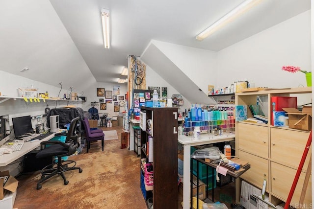 office space with vaulted ceiling and concrete flooring