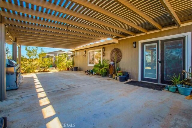 view of patio with a pergola and grilling area