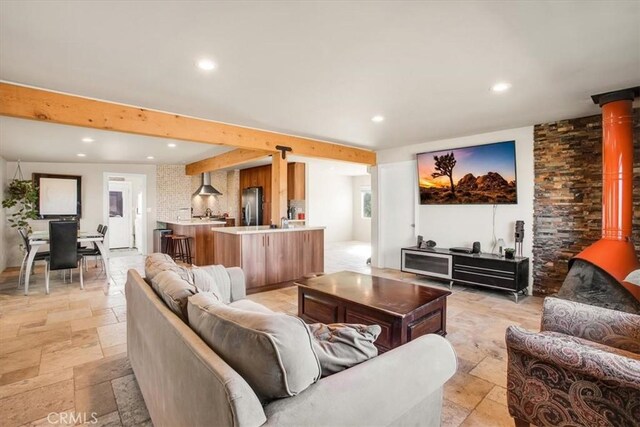 living room featuring beamed ceiling