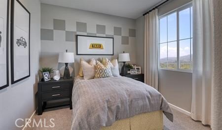 bedroom featuring multiple windows and light carpet