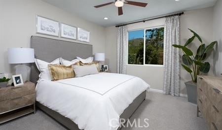 carpeted bedroom featuring ceiling fan