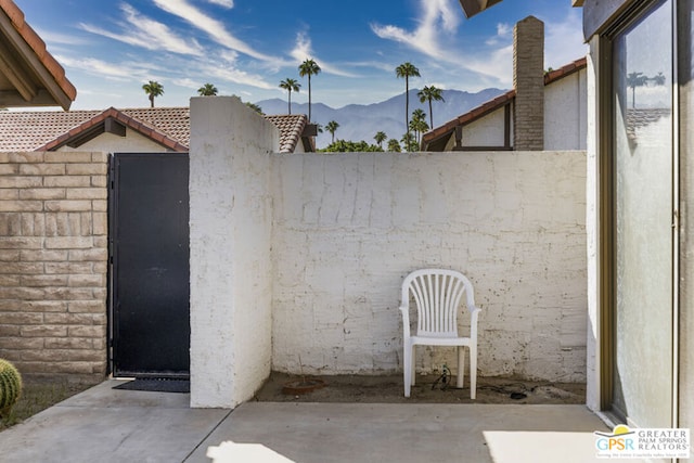 view of patio / terrace with a mountain view