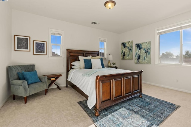 bedroom featuring light carpet