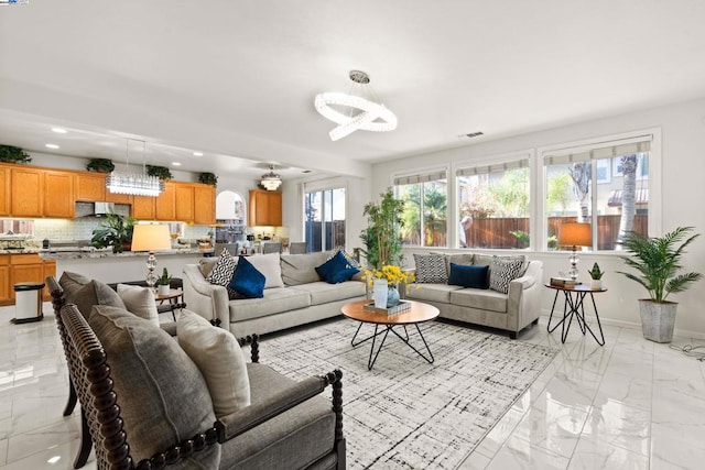 living room featuring an inviting chandelier