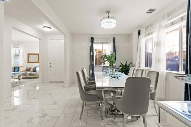 dining room with a chandelier