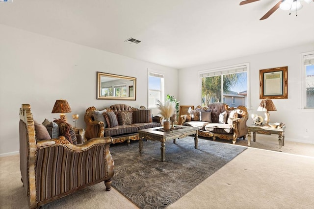 living room with carpet and ceiling fan