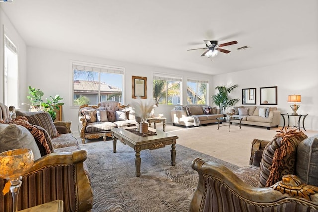 living room with carpet and ceiling fan