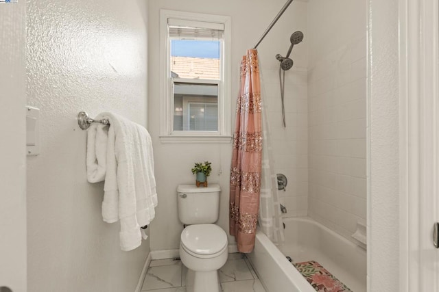 bathroom with shower / bath combination with curtain and toilet