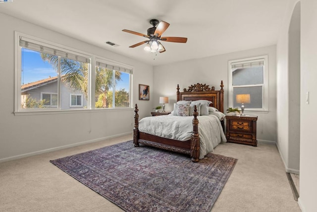 bedroom featuring ceiling fan and light colored carpet