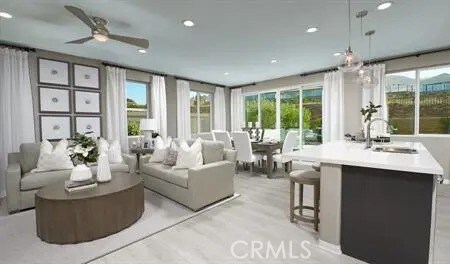 sunroom with sink and ceiling fan