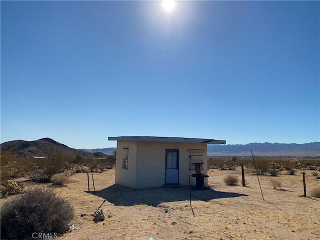 view of outdoor structure with a mountain view