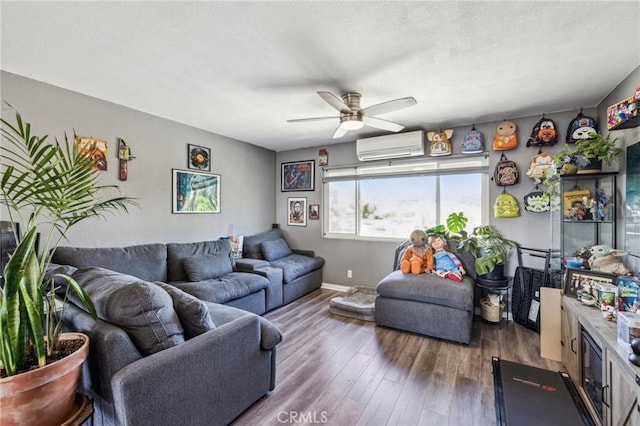 living room featuring a wall mounted air conditioner, dark hardwood / wood-style floors, and ceiling fan