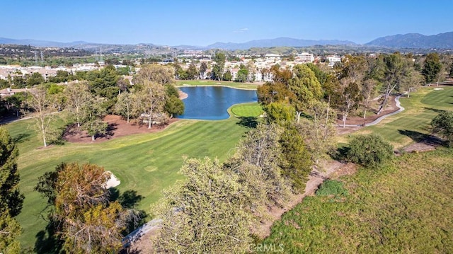 drone / aerial view with a water and mountain view