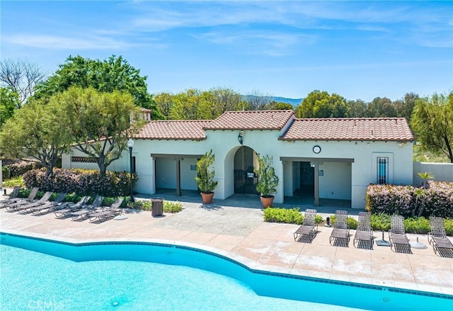 back of property featuring a patio