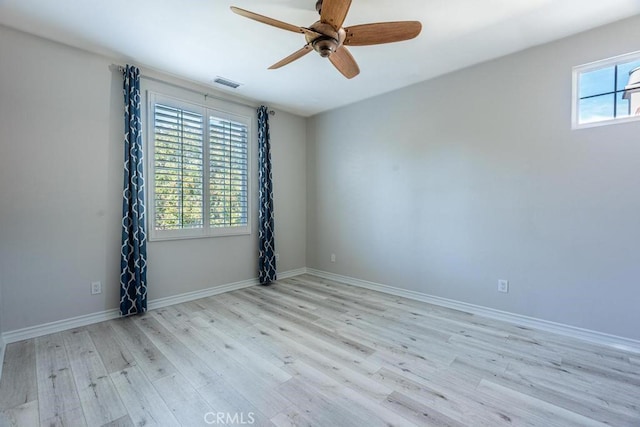 unfurnished room featuring light hardwood / wood-style floors, plenty of natural light, and ceiling fan