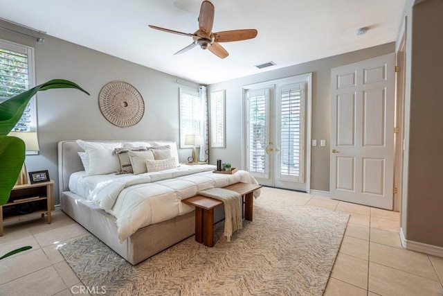 bedroom with access to outside, ceiling fan, french doors, and light tile patterned floors